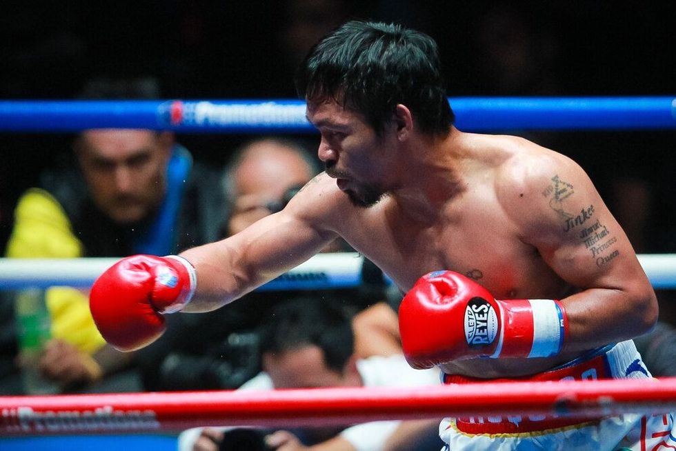 Philippines' Manny Pacquiao fights Argentina's Lucas Matthysse (not in picture) during their world welterweight boxing championship at Axiata Arena.
