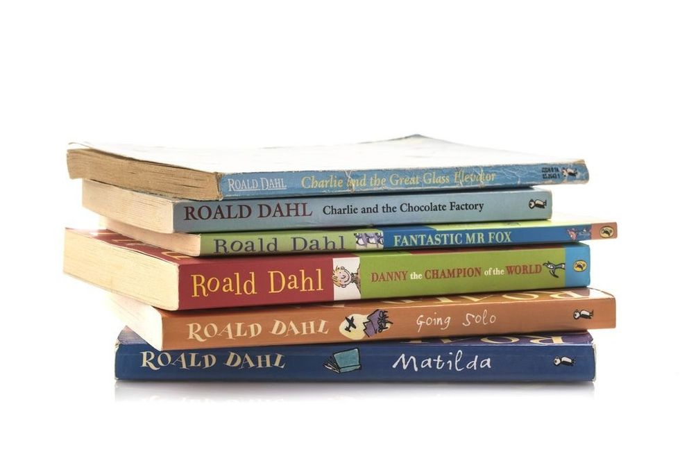 Pile of old Roald Dahl books on a white background