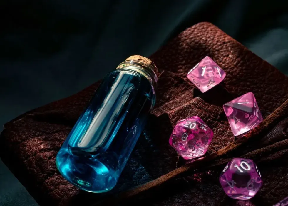 pink d20 dice with blue magic potion