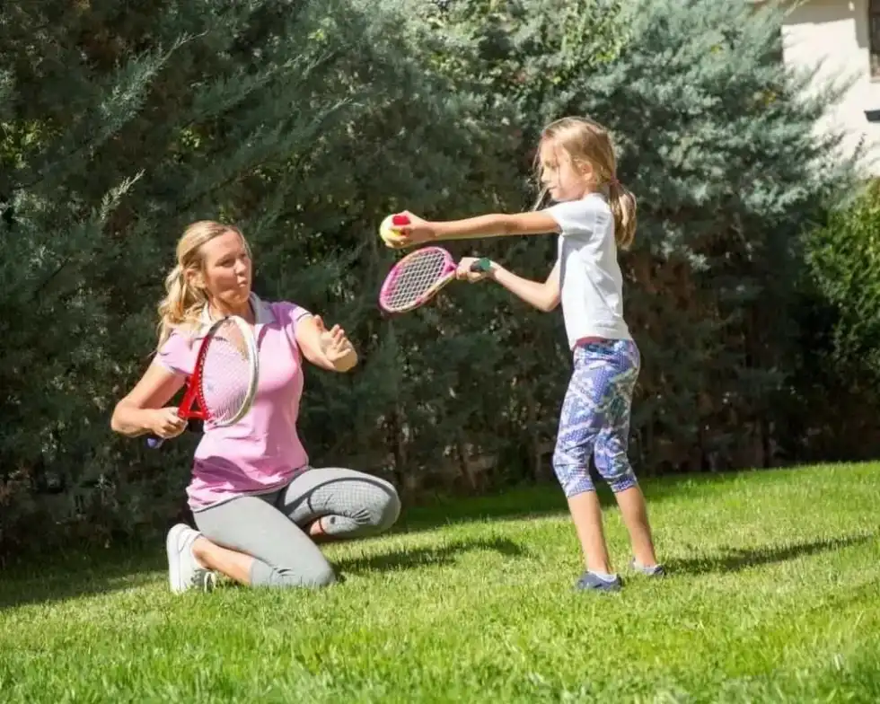 Playing tennis at home.
