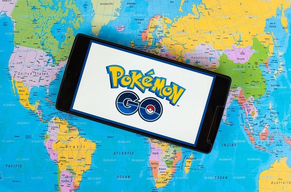 Pokemon Go game logo displayed on phone.