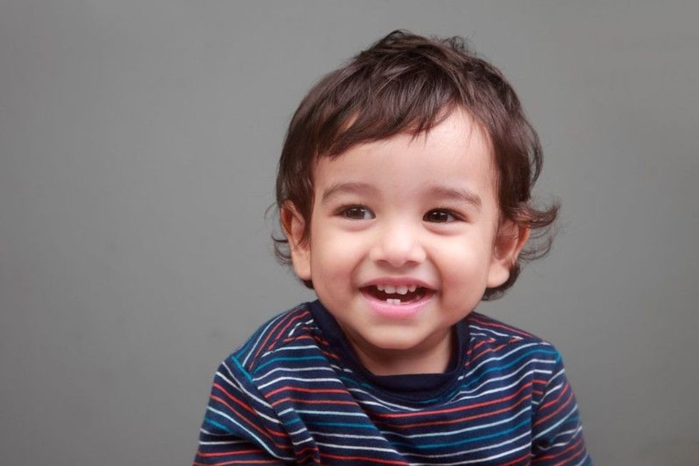 Portrait of a happy smiling baby boy.