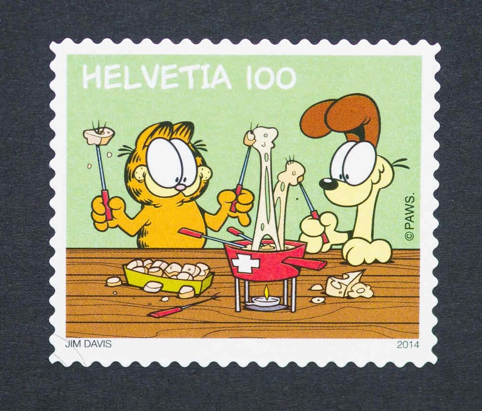 Post card of Garfield eating food