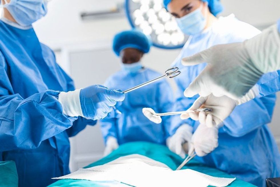 Professional Medical Doctors Performing Surgery.