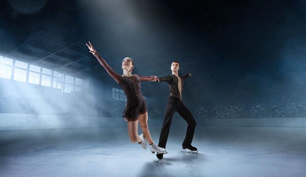 Professional skating couple and dancers.