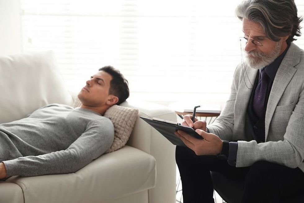 Psychiatrist checking a patient