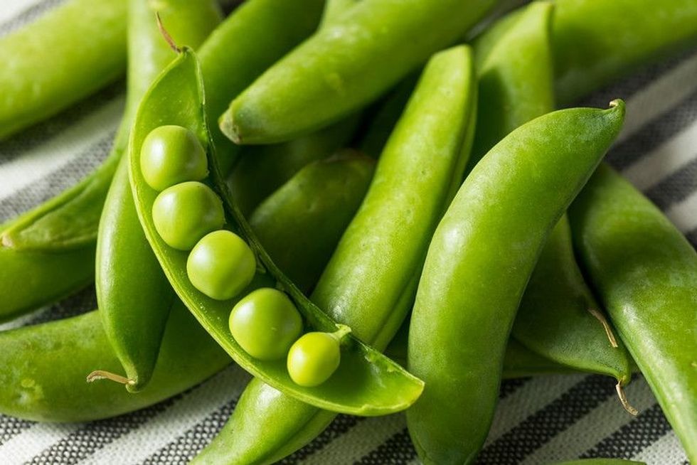 Raw Green Organic Snap Peas in a Bowl