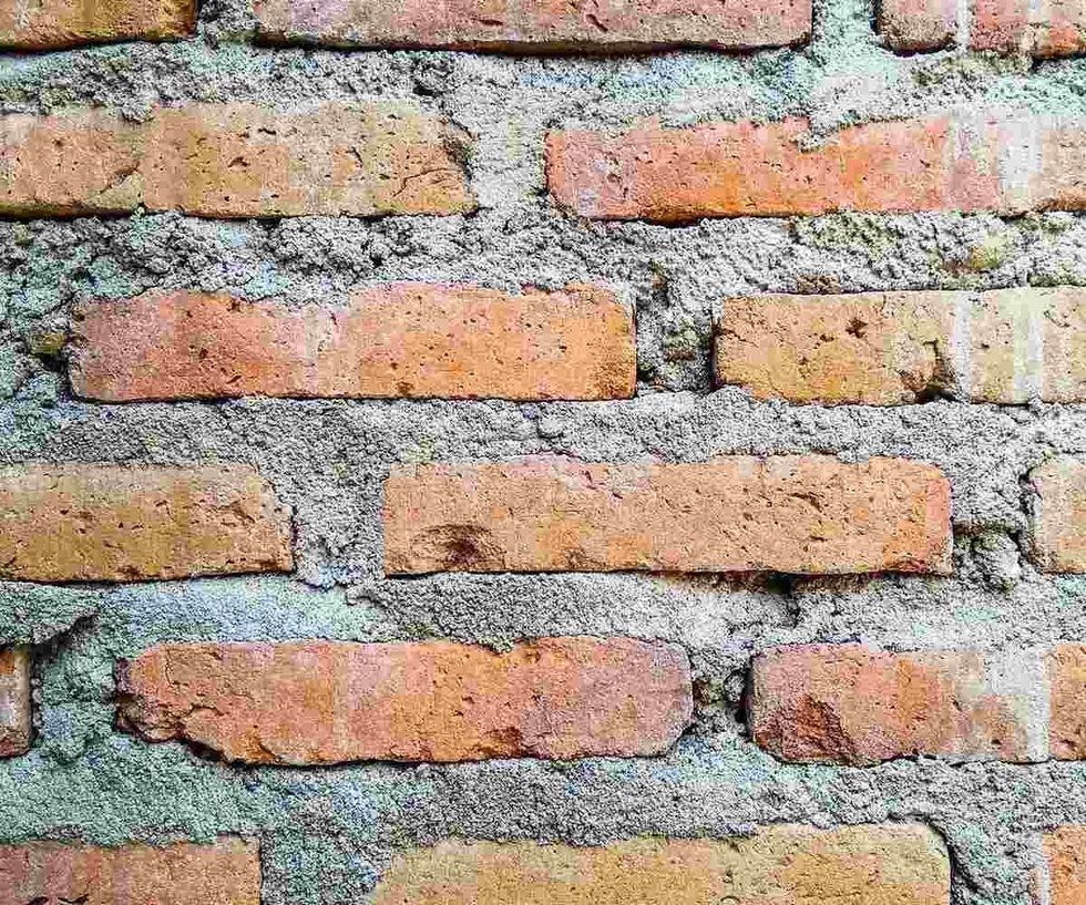 Red brick wall with cement.  