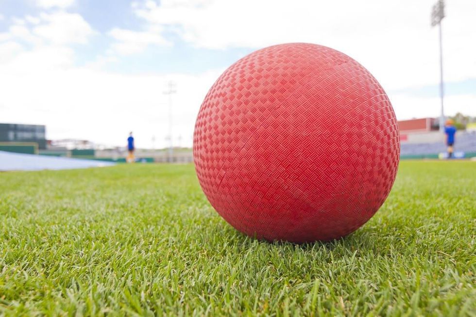 Red Kick Ball on grass field