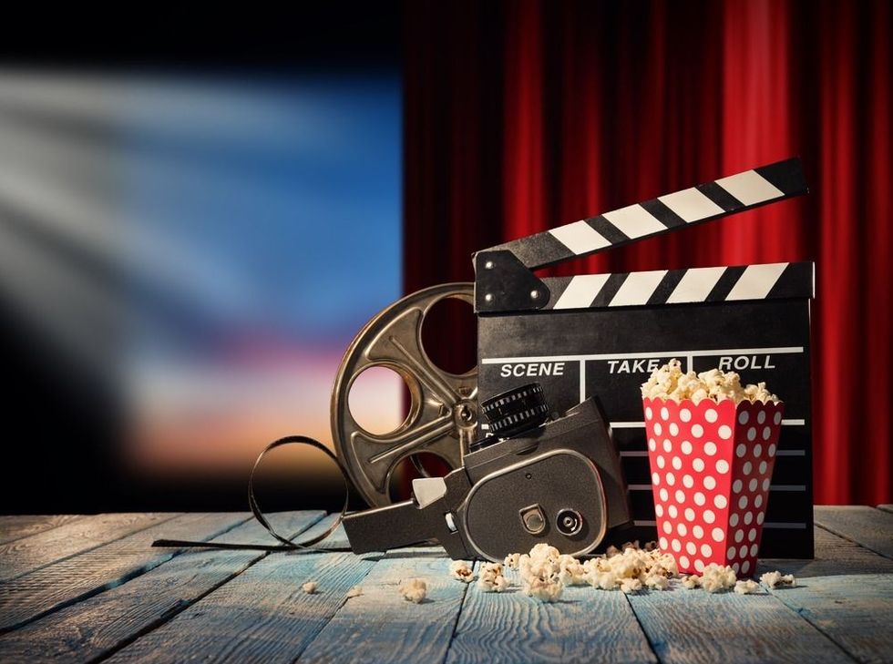 Retro film production accessories placed on wooden planks.