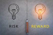 Risk and reward word with grey background.