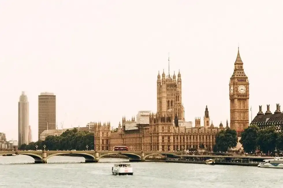 River Thames and the Houses of Parliament taken from across the river with the river ferry in the foreground