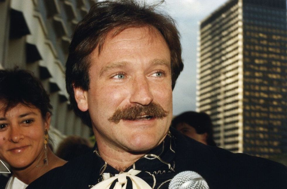 Robin Williams arrives at a celebrity event