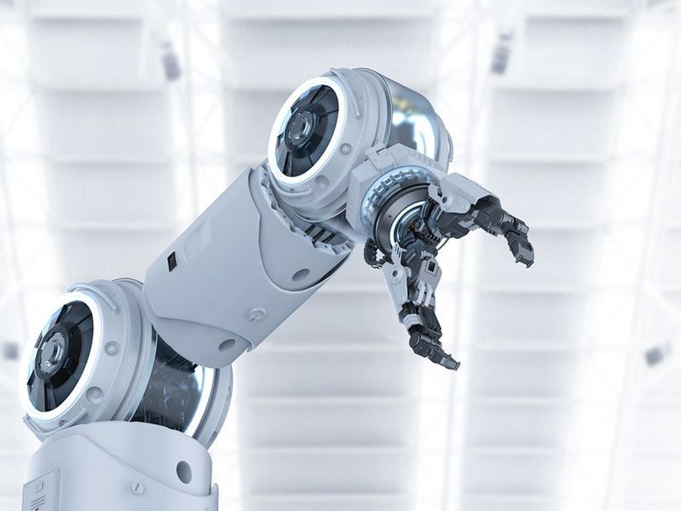 Robotic hand in white background.
