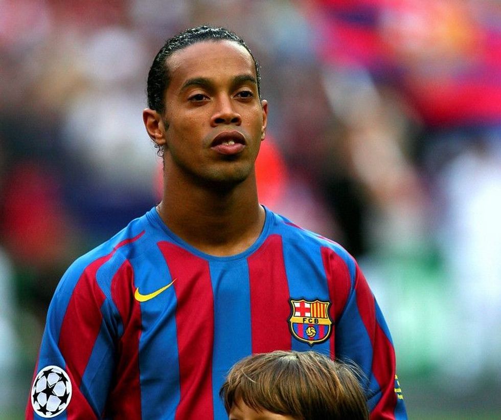 Ronaldinho standing for the anthem before the football match