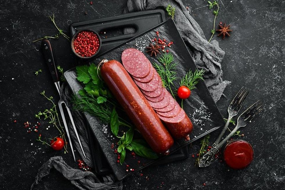 Salami with fresh rosemary and spices. 