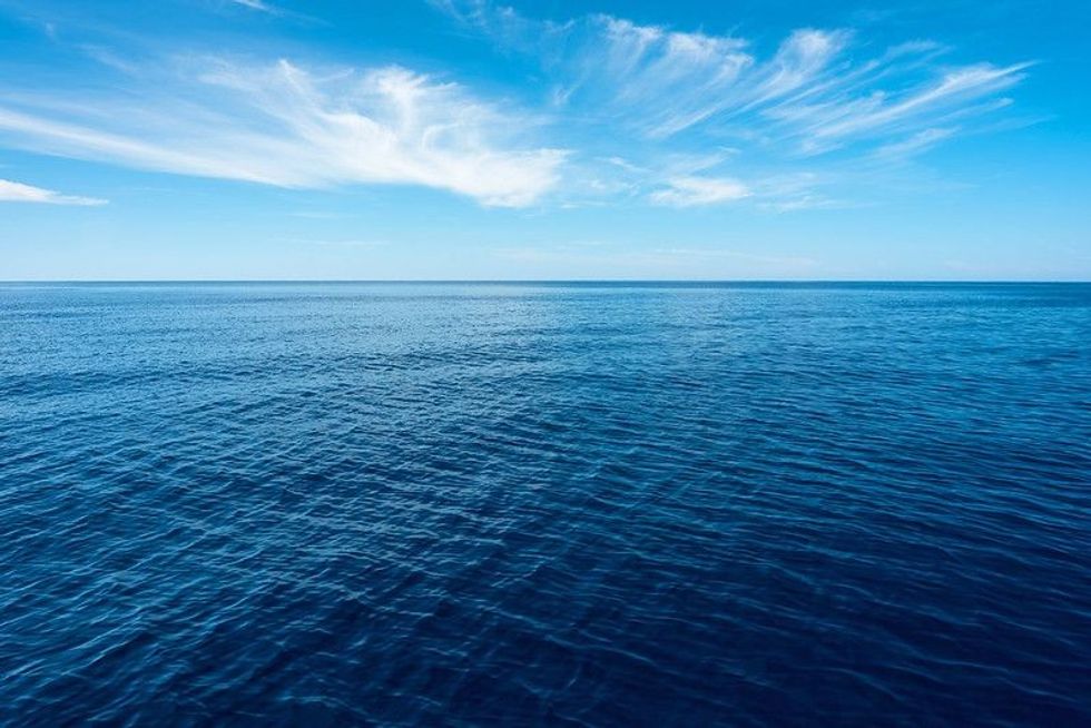 Scene of Ocean and Sky in blue.