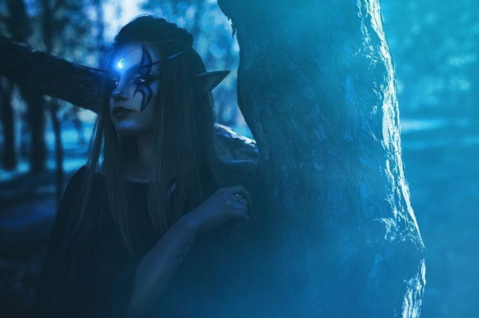 Shooting cosplay girl elf in the forest.