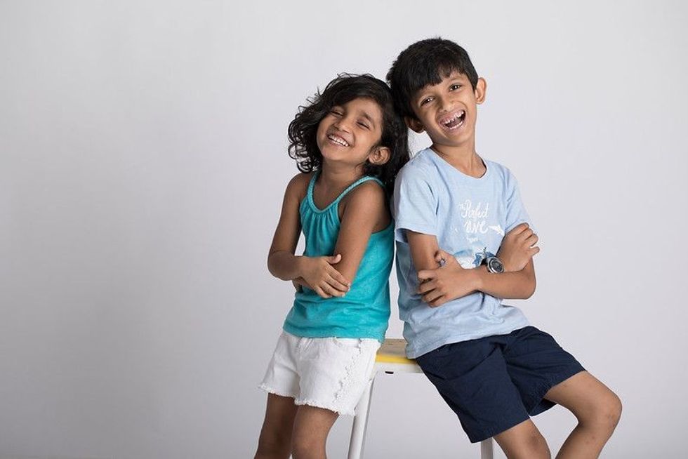 Siblings laughing together