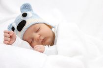Sleeping baby with knitted hat
