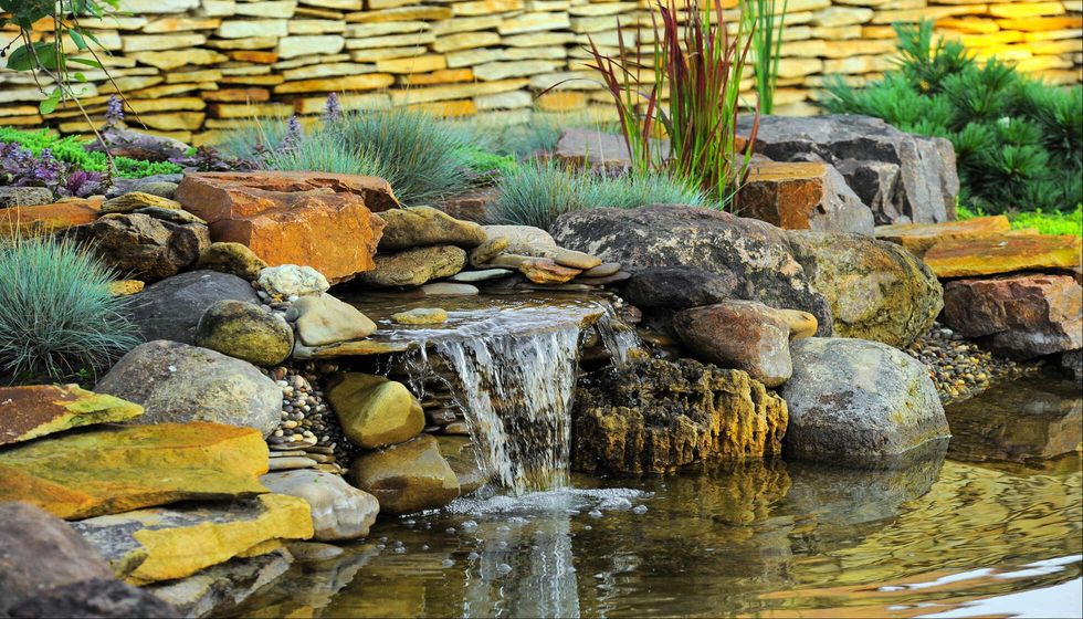 Small waterfall in home garden.