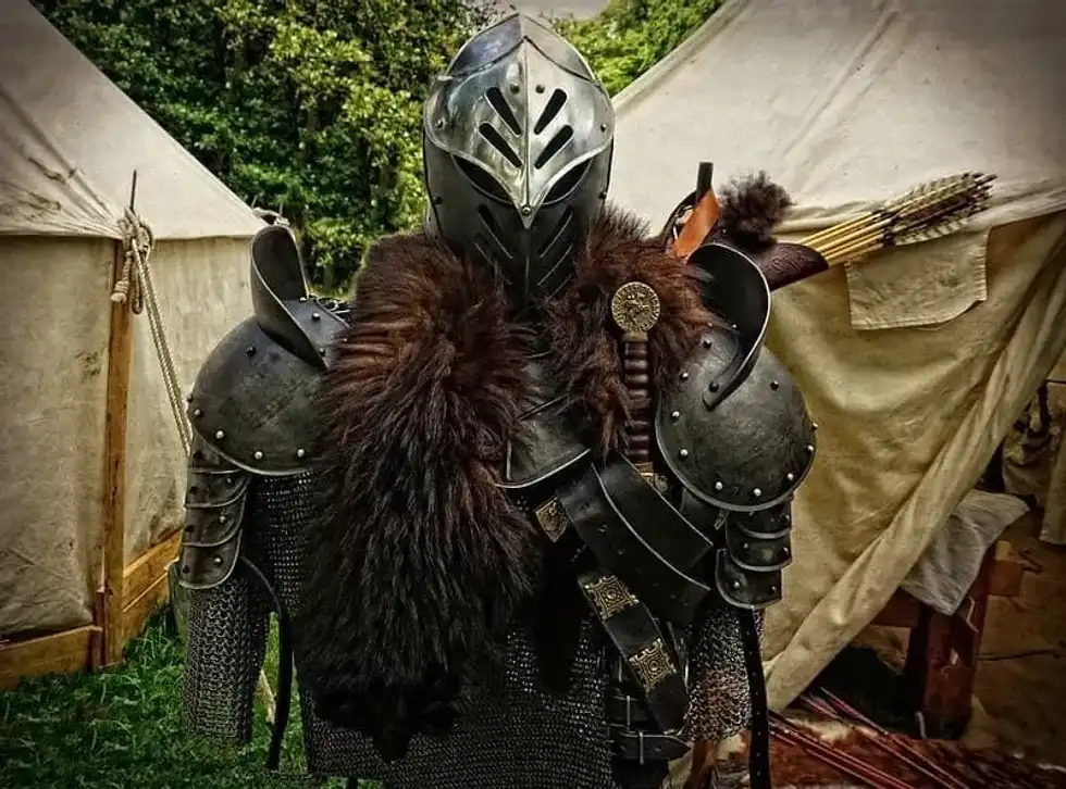 Soldier's armour from the Iron Age, in between two tents.