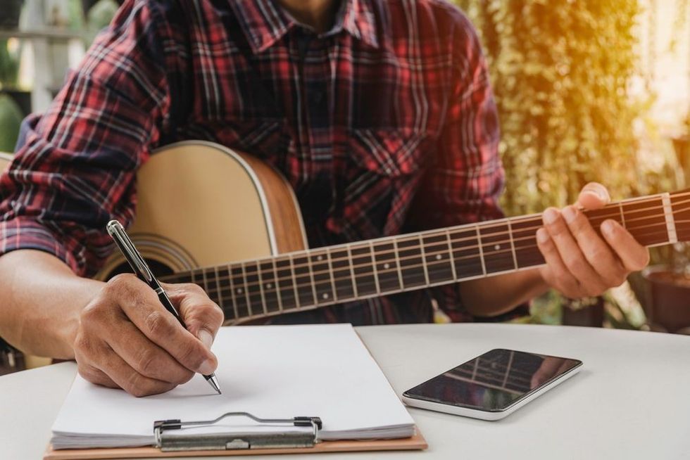 Song writer holding pen for compose a song