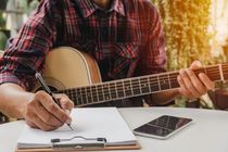 Song writer holding pen for compose a song