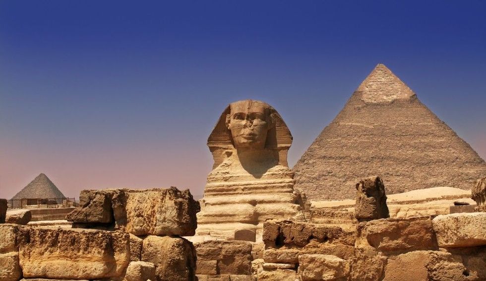 Sphinx Guarding a Pyramid.