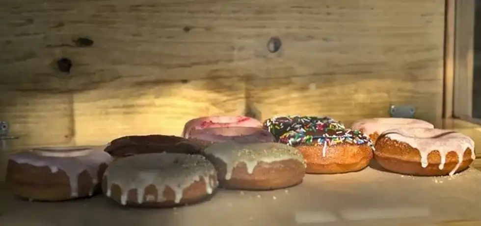Sprinkle Day is the day for you to enjoy a chocolate icing donut with some vanilla ice cream and strawberry confetti.