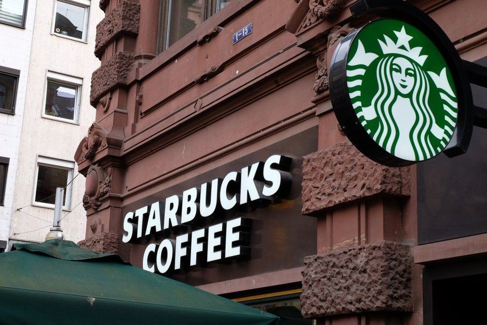 Starbucks high-end coffee shop on the Kaiserstraße(street) across from the Junior Haus in Frankfurt Germany.