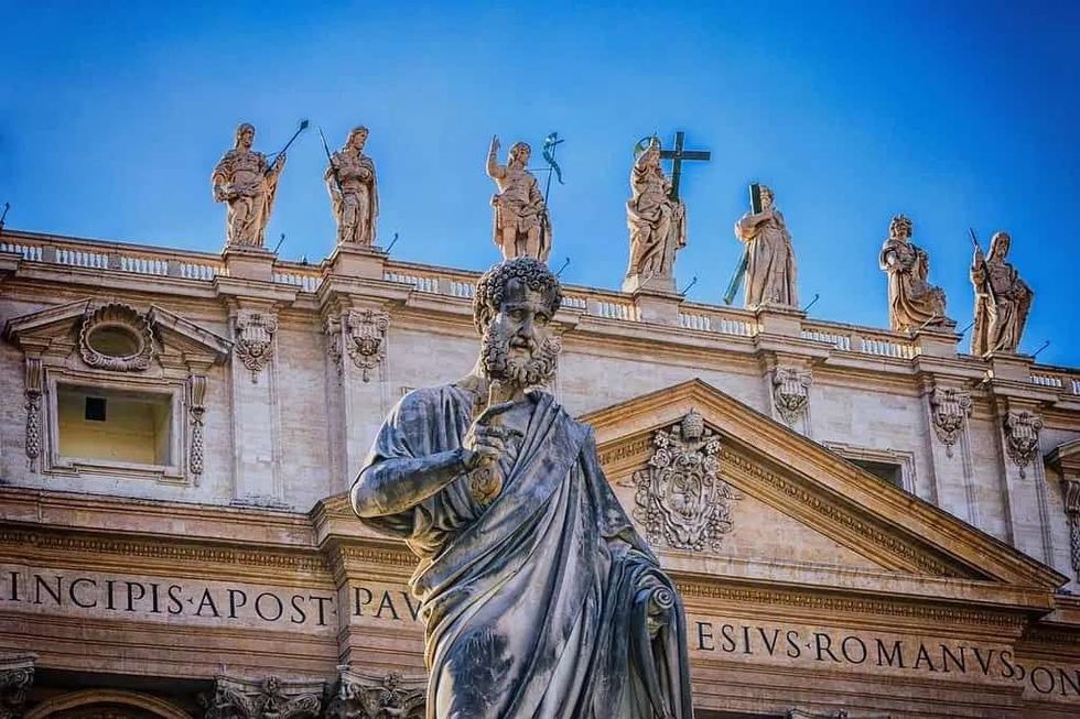 Statues of the Roman gods on the top of a building.