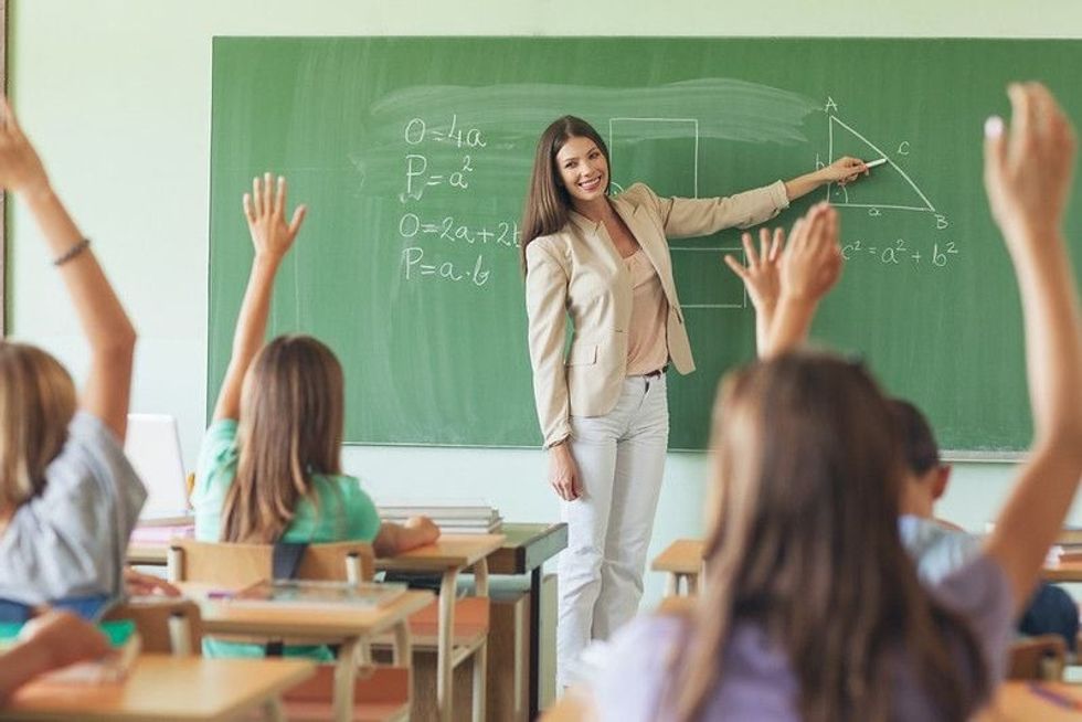 Students answering the teacher's question in a maths lesson.