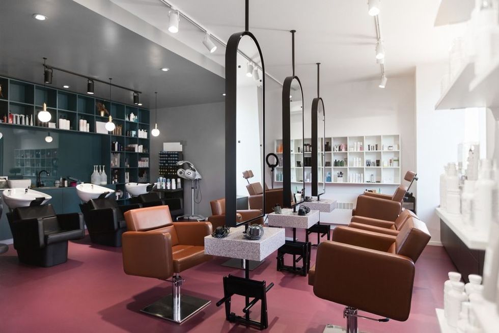 Stylish beauty salon interior. Hairdresser and makeup artist workplaces in one room