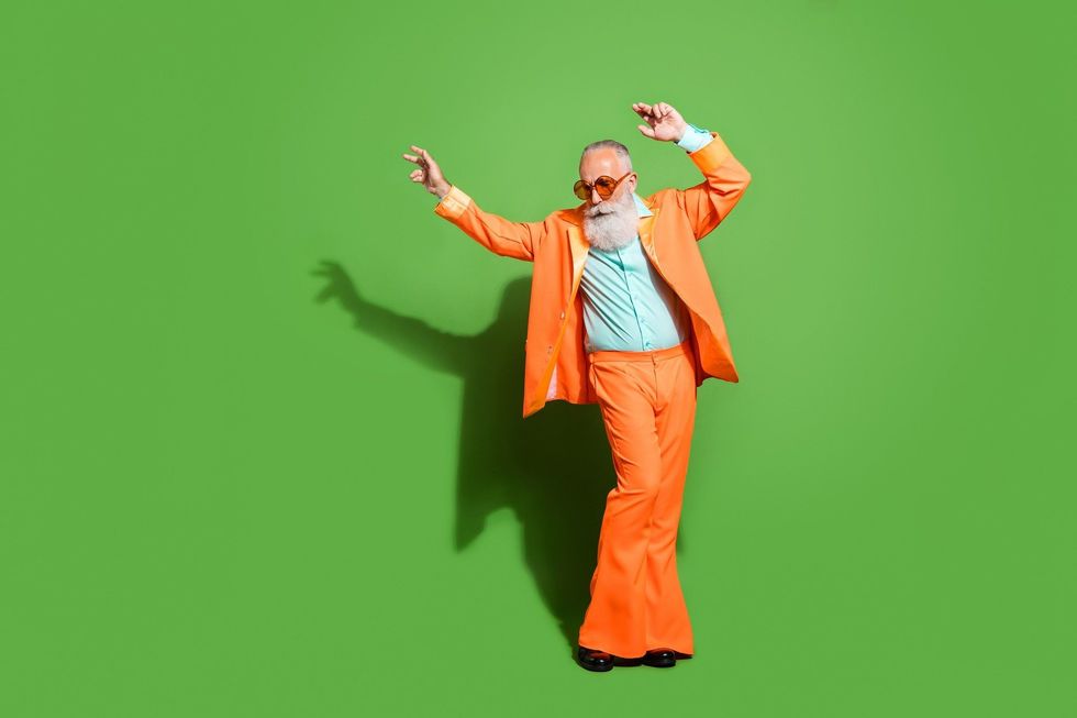 Stylish uncle dressed in orange suit