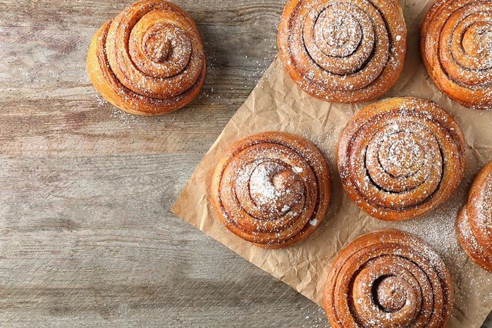 Sweet cinnamon rolls on table