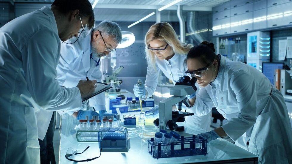 Team of Medical Research Scientists Collectively Working on a New Generation Experimental Drug Treatment.
