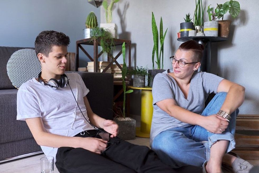 Teen boy talking to professional psychologist