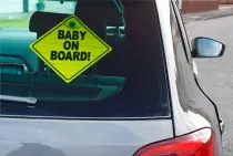 The baby on board is a safety sign and should be hung up by all parents who have children under the age of ten.