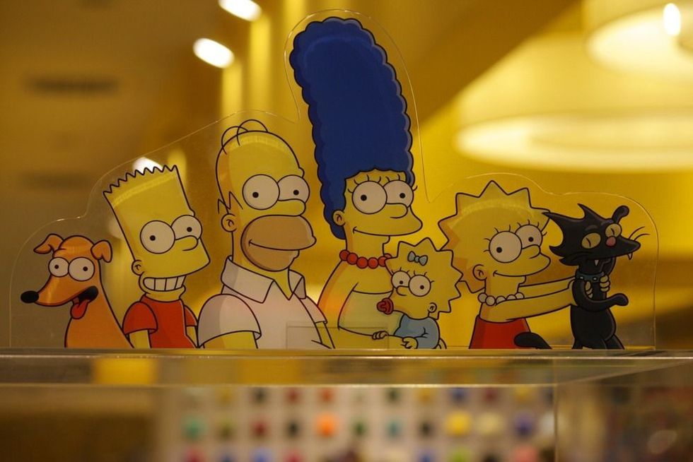 The characters of the Simpson comic tv series: Homer, Maggie, Lisa, Marge and Bart Simpson.