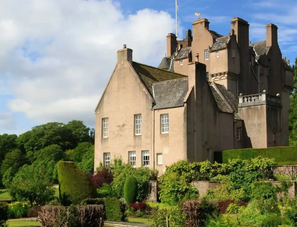 The exterior of Crathes Castle Garden against a blue sky.