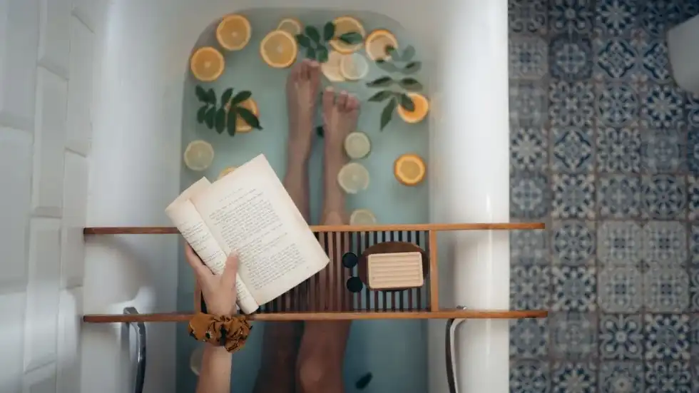 The idea of a happy Read In The Bathtub Day is soaking in a bathtub and enjoying bathroom reading with a great book.