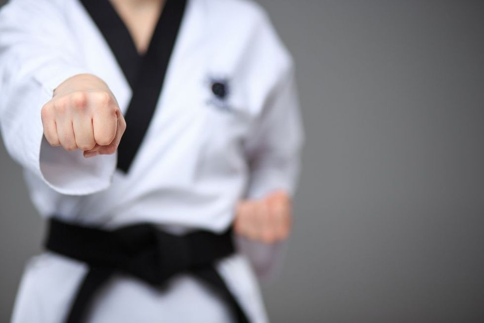 The karate girl with black belt.