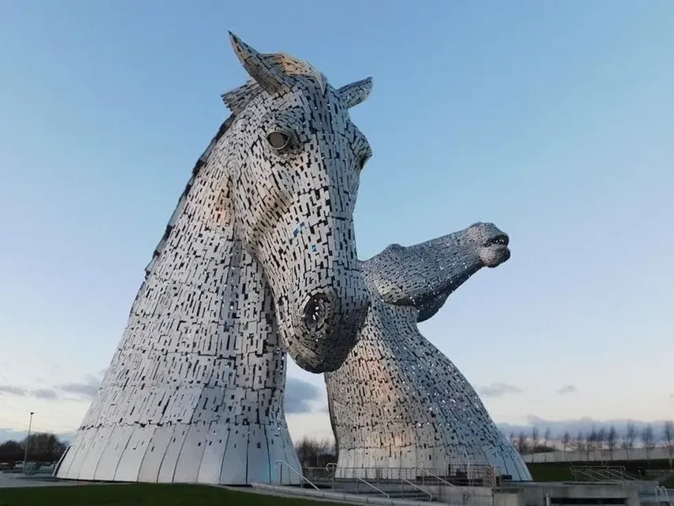 The large silver horse head figures of The Kelpies (and The Helix).