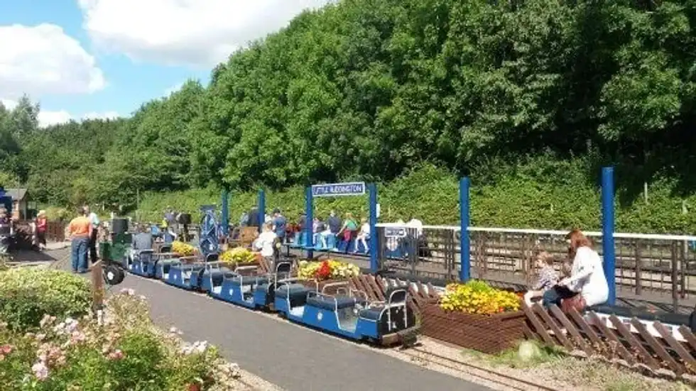 The miniature blue train at the railway at Rushcliffe Country Park.