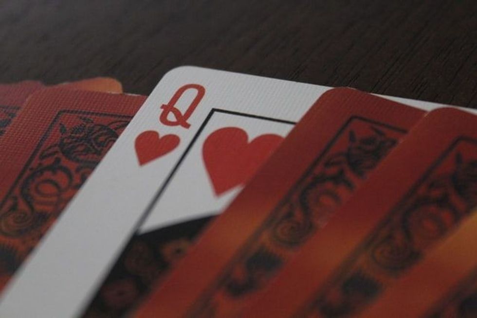 The queen in a deck of cards is a playing card with a queen image on it. A queen is usually ranked between the king and the jack in playing cards.