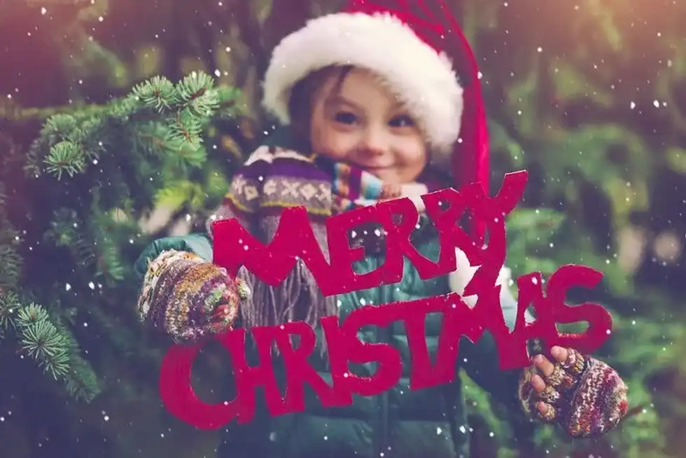 The Twelve Days of Toddler Christmas girl with sign.