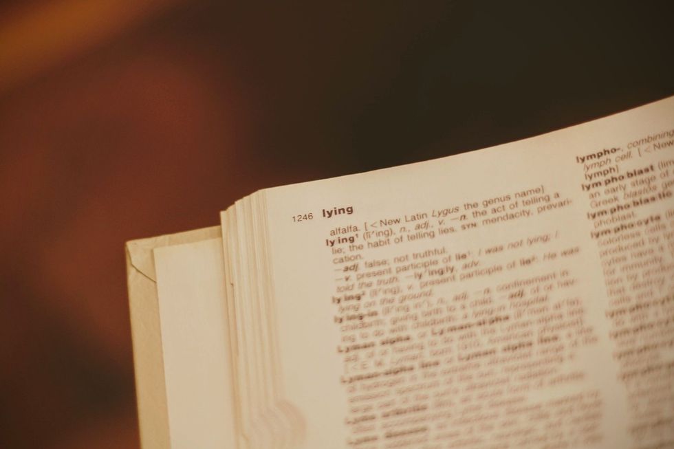 The word "lying" printed in bold at the top of a dictionary page.