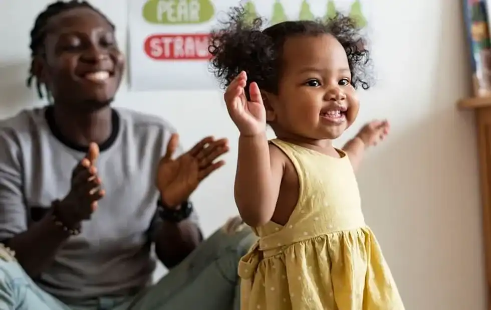 This preschooler loves moving and grooving as music plays.