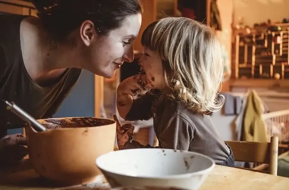Toddler and mum making coco pops cakes
